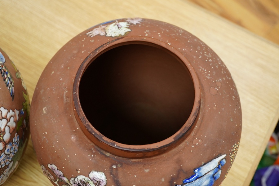 A pair of Japanese enamelled terracotta jars, c.1900, 26cm high. Condition - fair to good